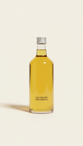 Anmasa Cold-Pressed Sunflower Oil bottle, 3/4 angle or top-down flat-lay depending on product shape; always placed on...