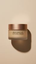 Restorative styling cream jar, perfectly centered horizontally and vertically with equal negative space above and below,...
